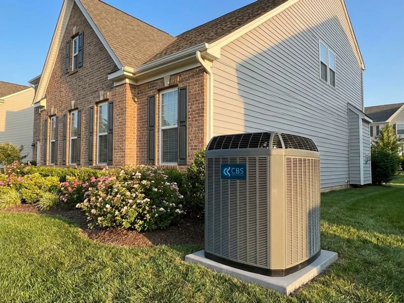 Modern central air conditioning system installed outside a beautiful Manassas, Virginia family home